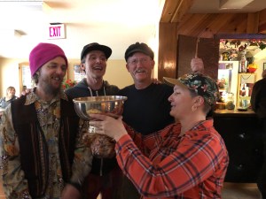 Dean, Kellie, Dan, and Lana admire the WWND Cup.